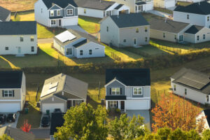 Aerial view of tightly located new family real estate in suburban area